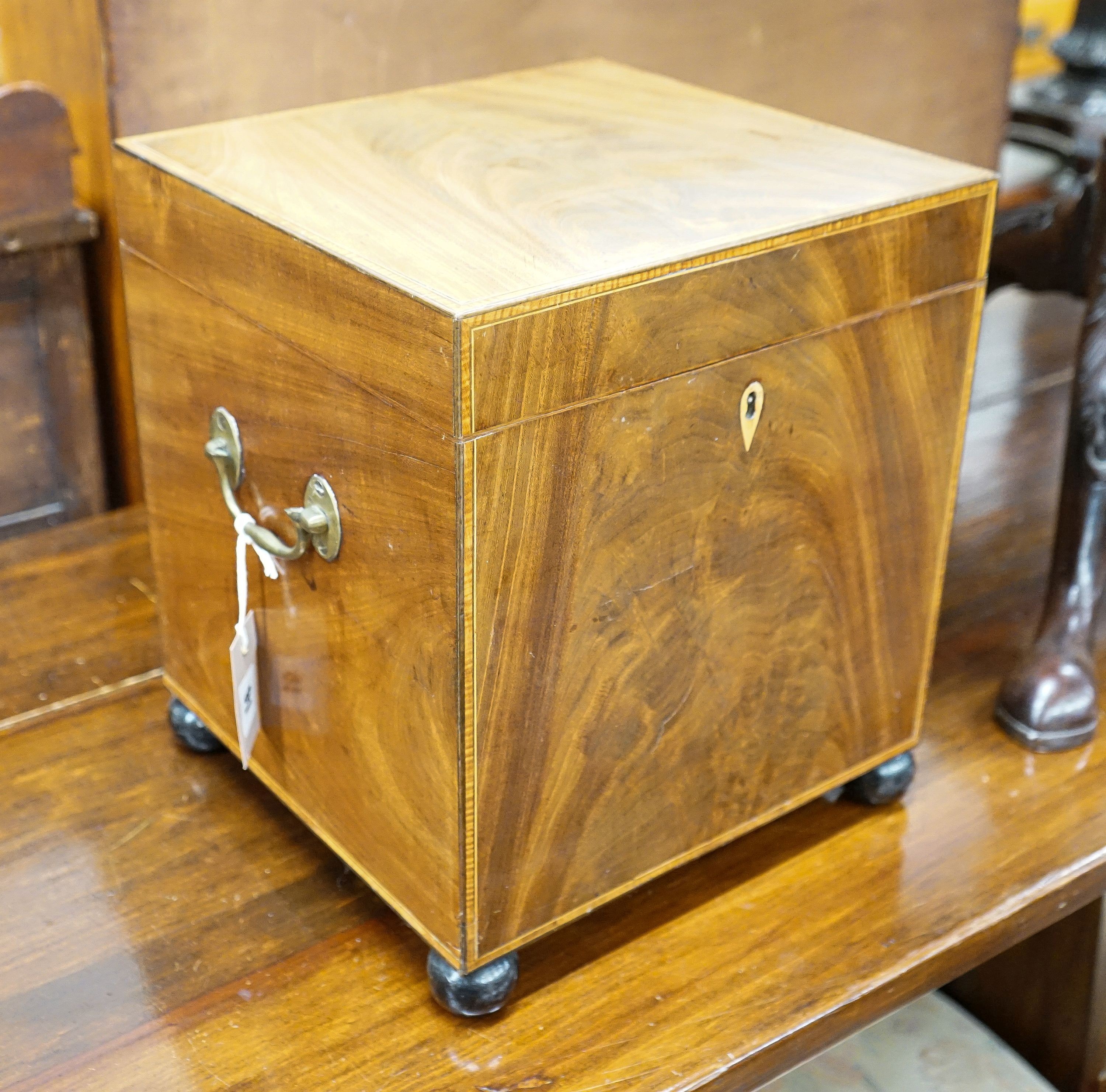 A small George III satinwood banded mahogany cellarette with divided interior, width 30cm, depth 29cm, height 35cm